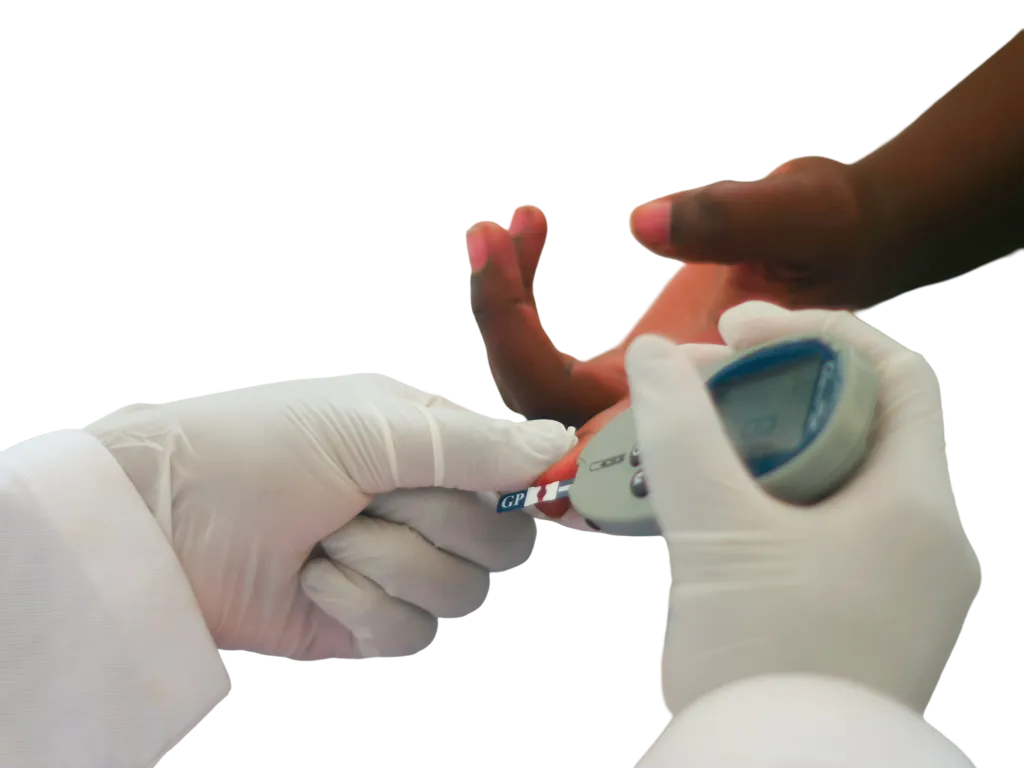A gloved clinician taking a finger-prick blood sample